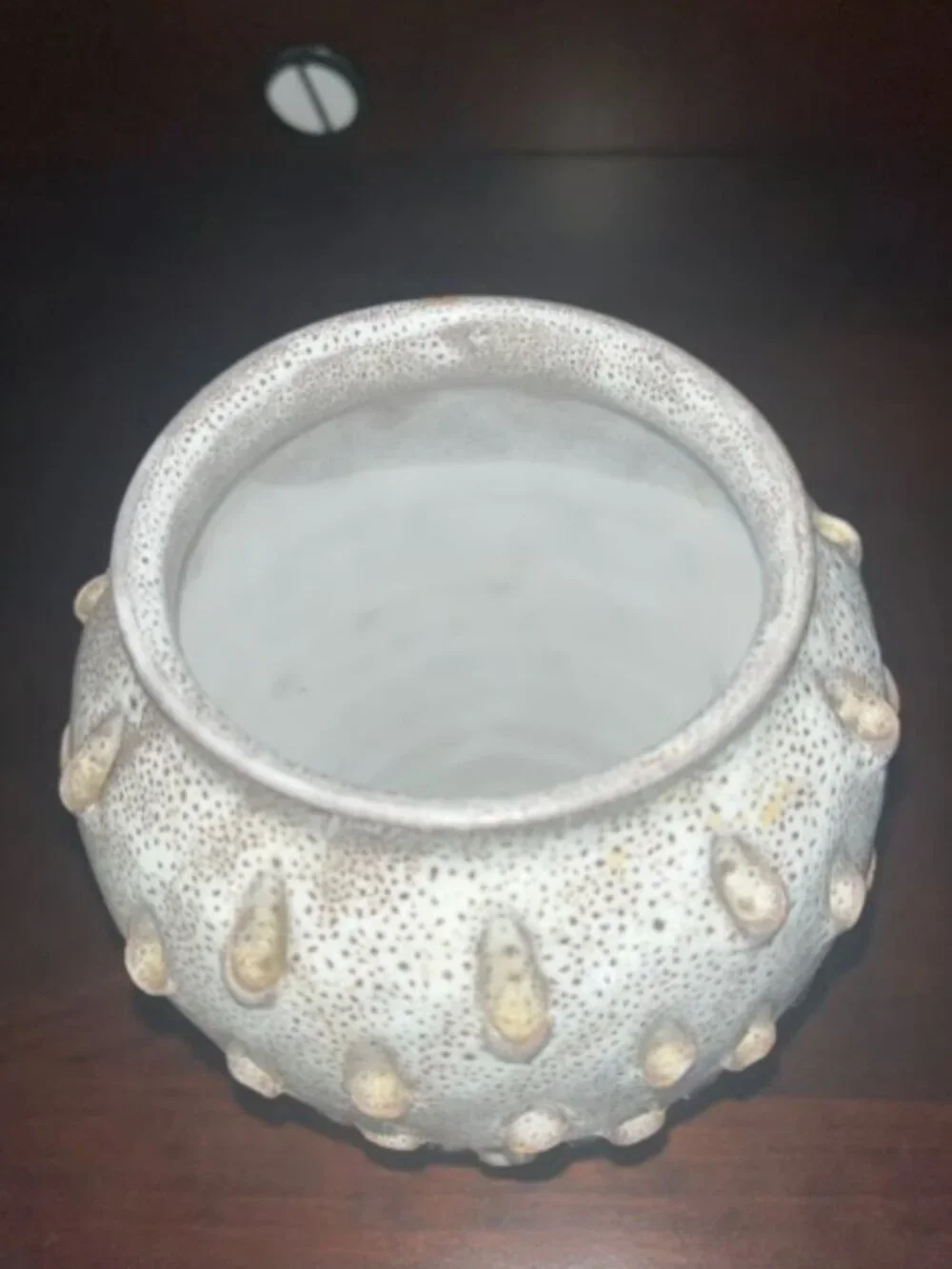 Ceramic vase with white speckled teardrop-shaped patterns
